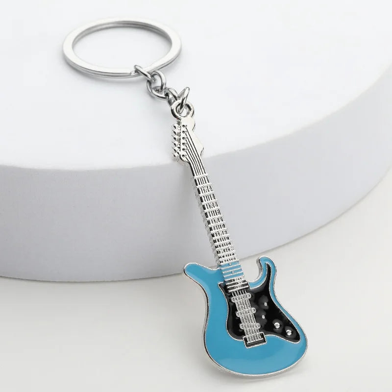 Llavero de guitarra eléctrica en aleación de zinc, souvenir para conciertos y festivales, en negro, blanco, rojo, rosa, azul o morado