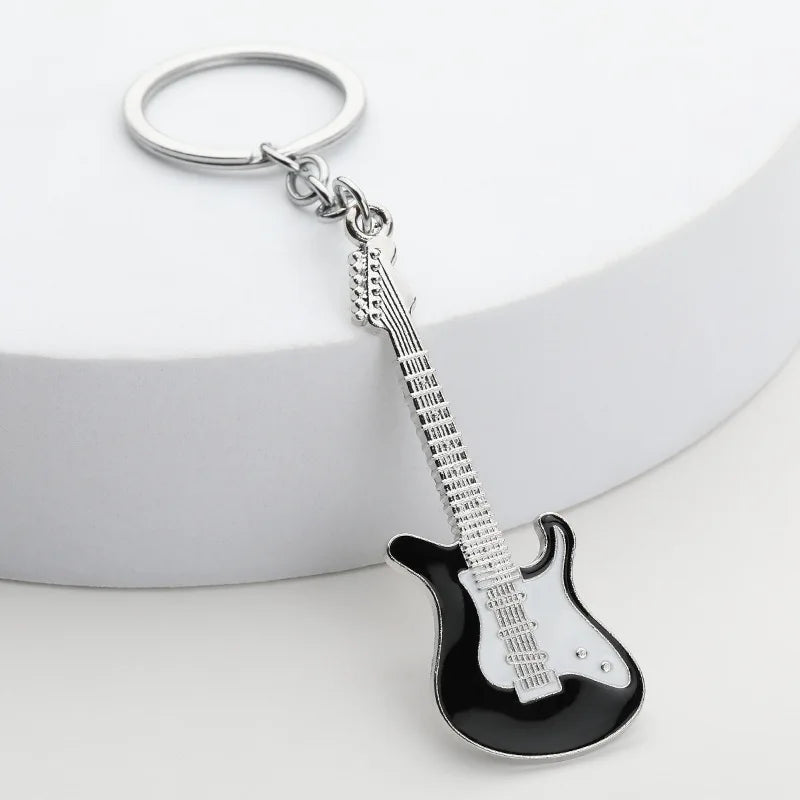Llavero de guitarra eléctrica en aleación de zinc, souvenir para conciertos y festivales, en negro, blanco, rojo, rosa, azul o morado