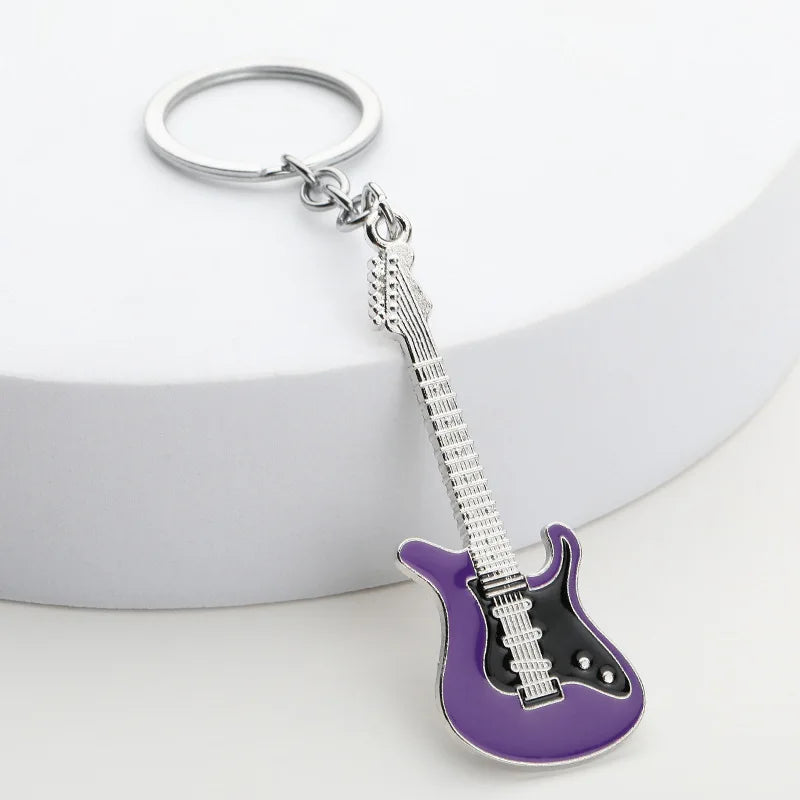 Llavero de guitarra eléctrica en aleación de zinc, souvenir para conciertos y festivales, en negro, blanco, rojo, rosa, azul o morado